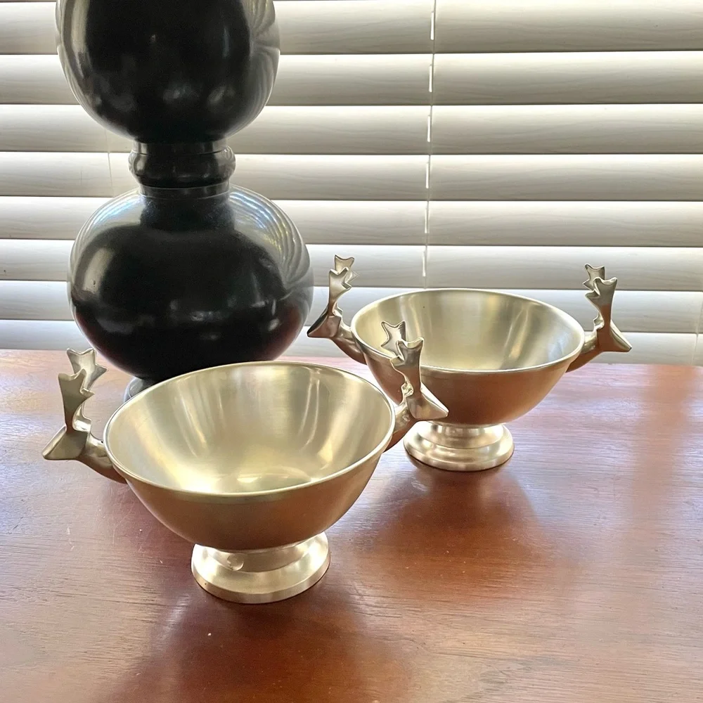 Pair of Crate&Barrel modern reindeer holiday stainless steel footed bowls, 6”
